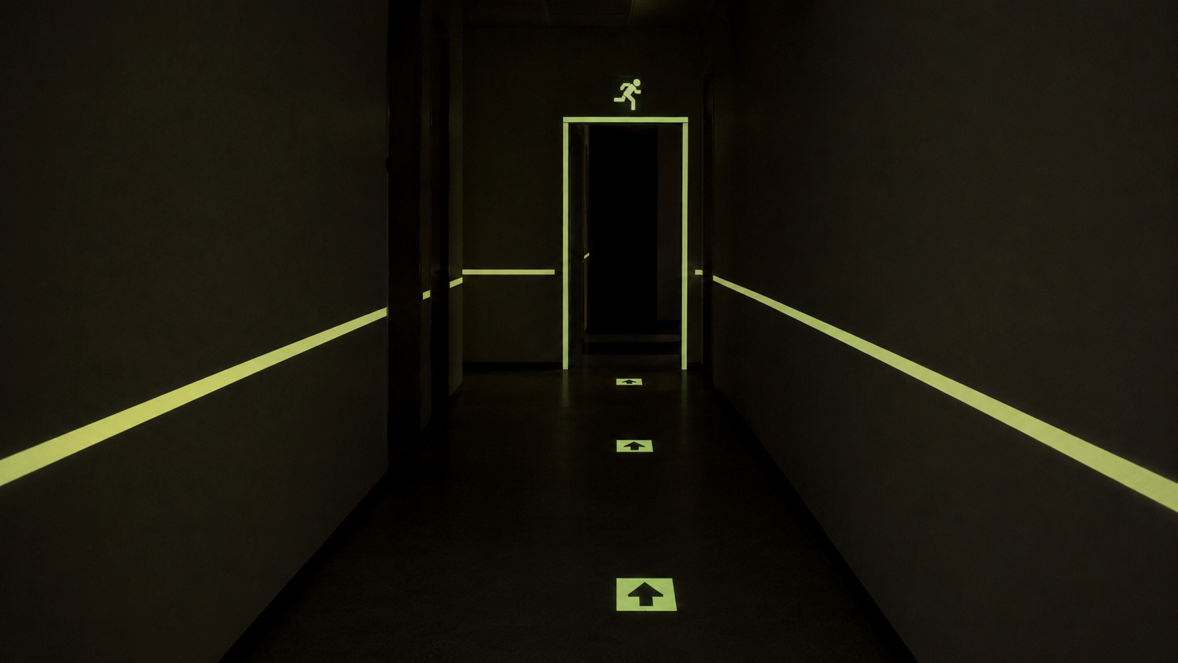 photoluminescent-emergency-exit-markings-glowing-during-power-failure.png